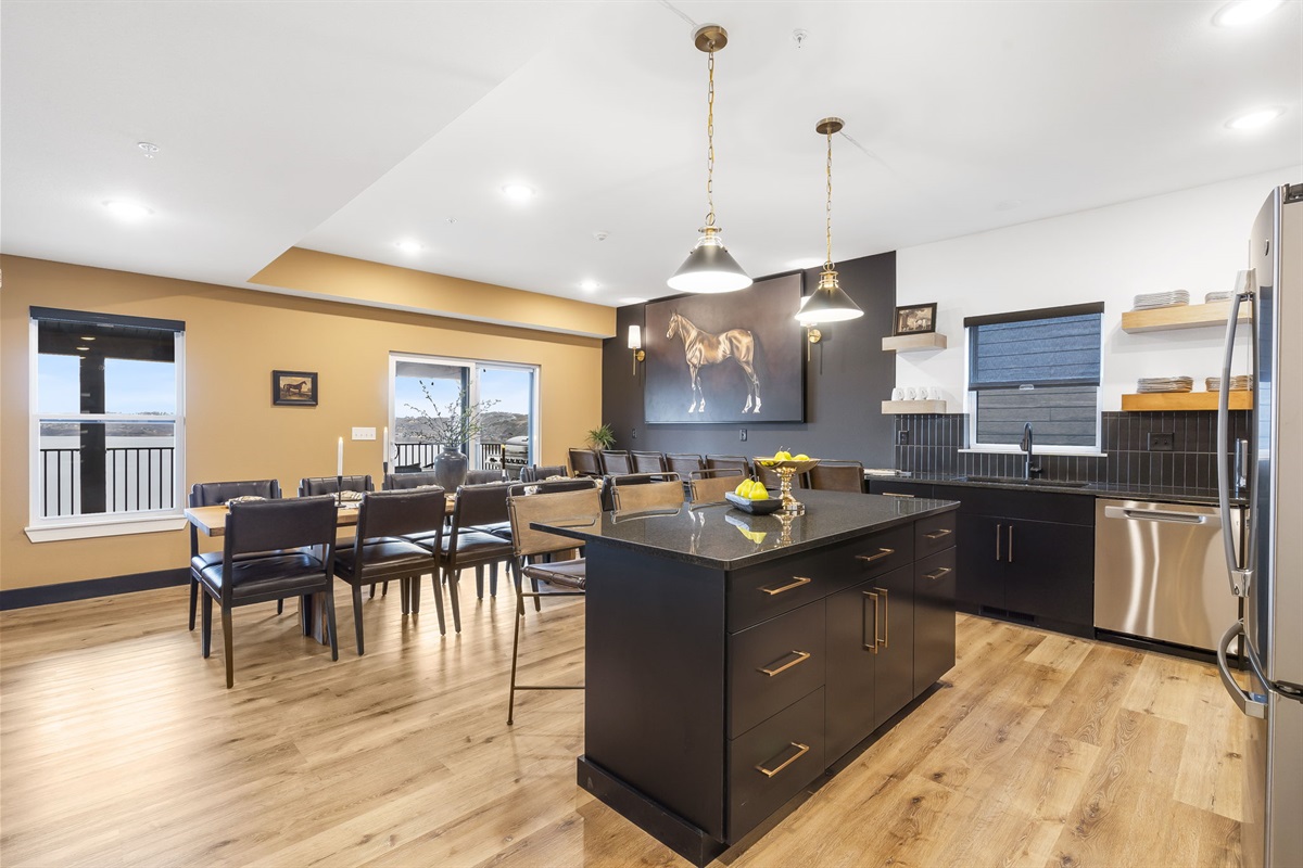 Dining table, bar seating, and extra bar seating along the wall