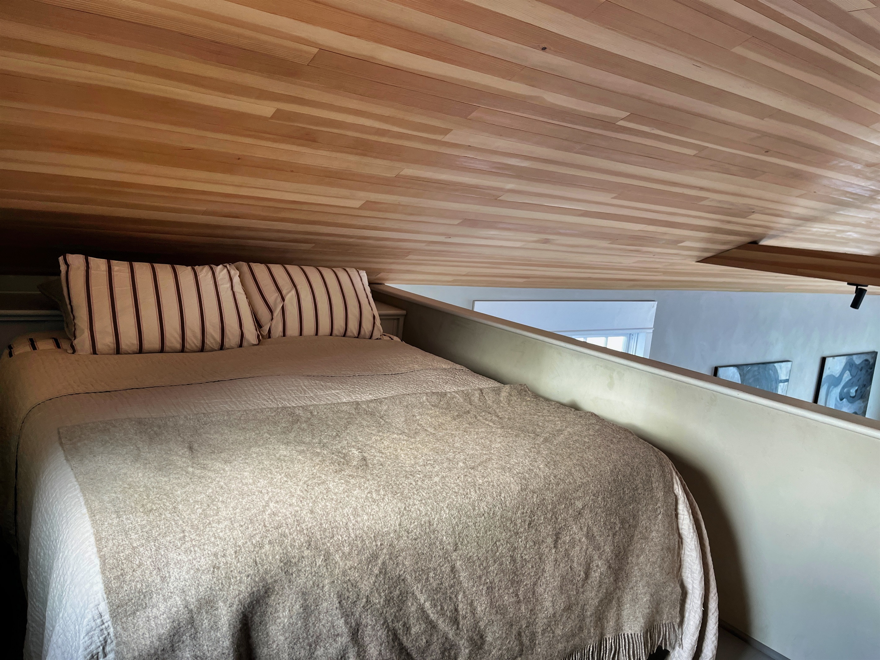 Hawk Field House - Queen bed in the loft sleeping area above the kitchen.