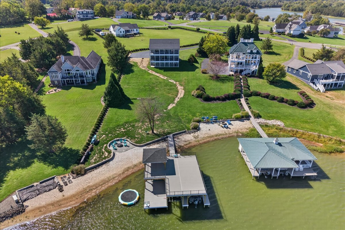 Aerial view showcasing the home’s spacious lot and proximity to the waterfront.