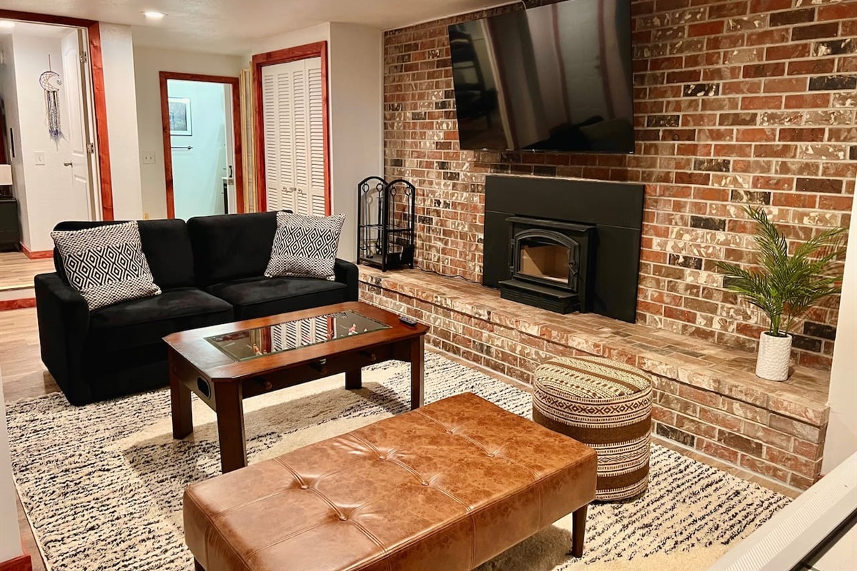 Lower Floor level game room with wood burning fireplace.