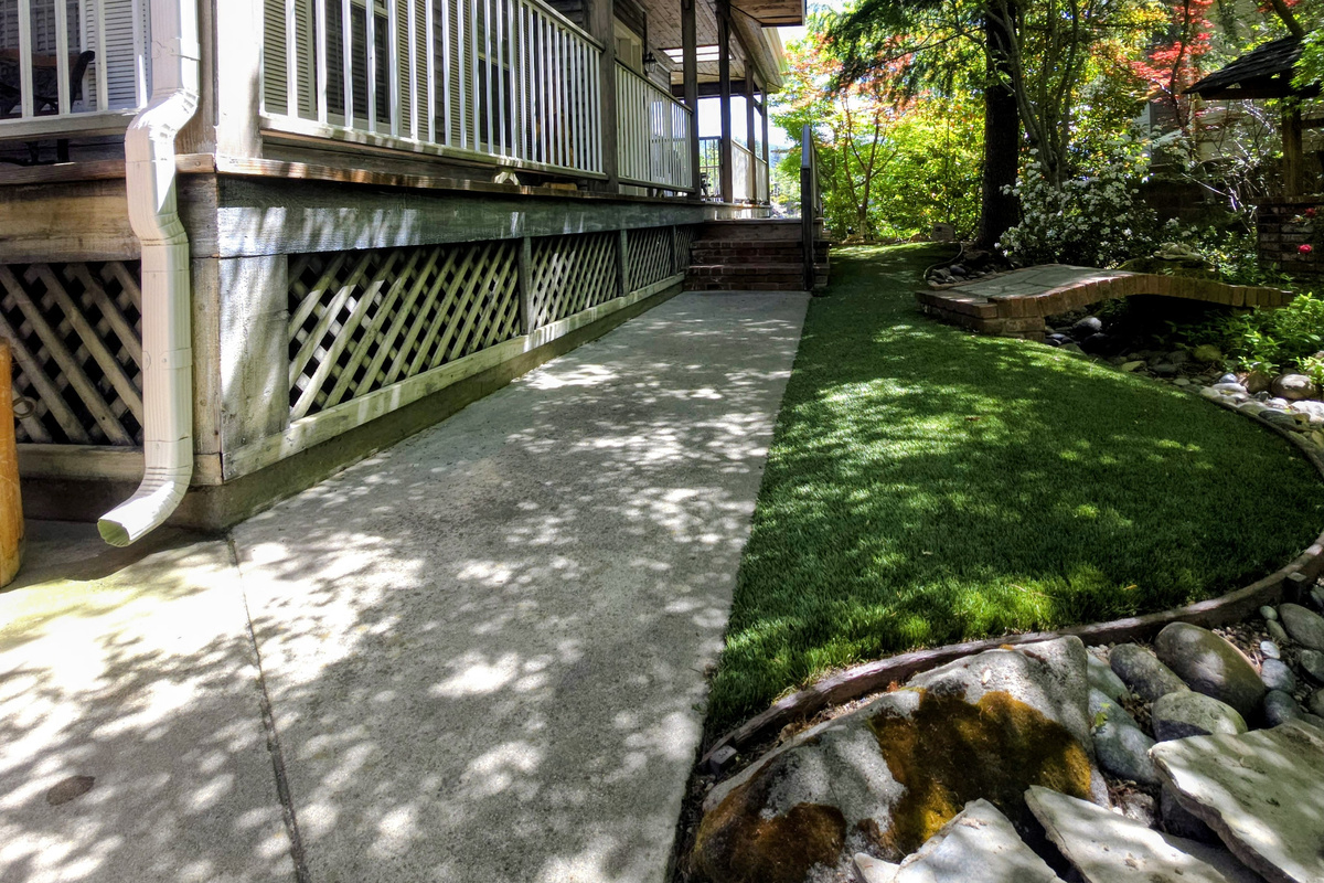 Walkway to the front door and to the gate leading to the backyard