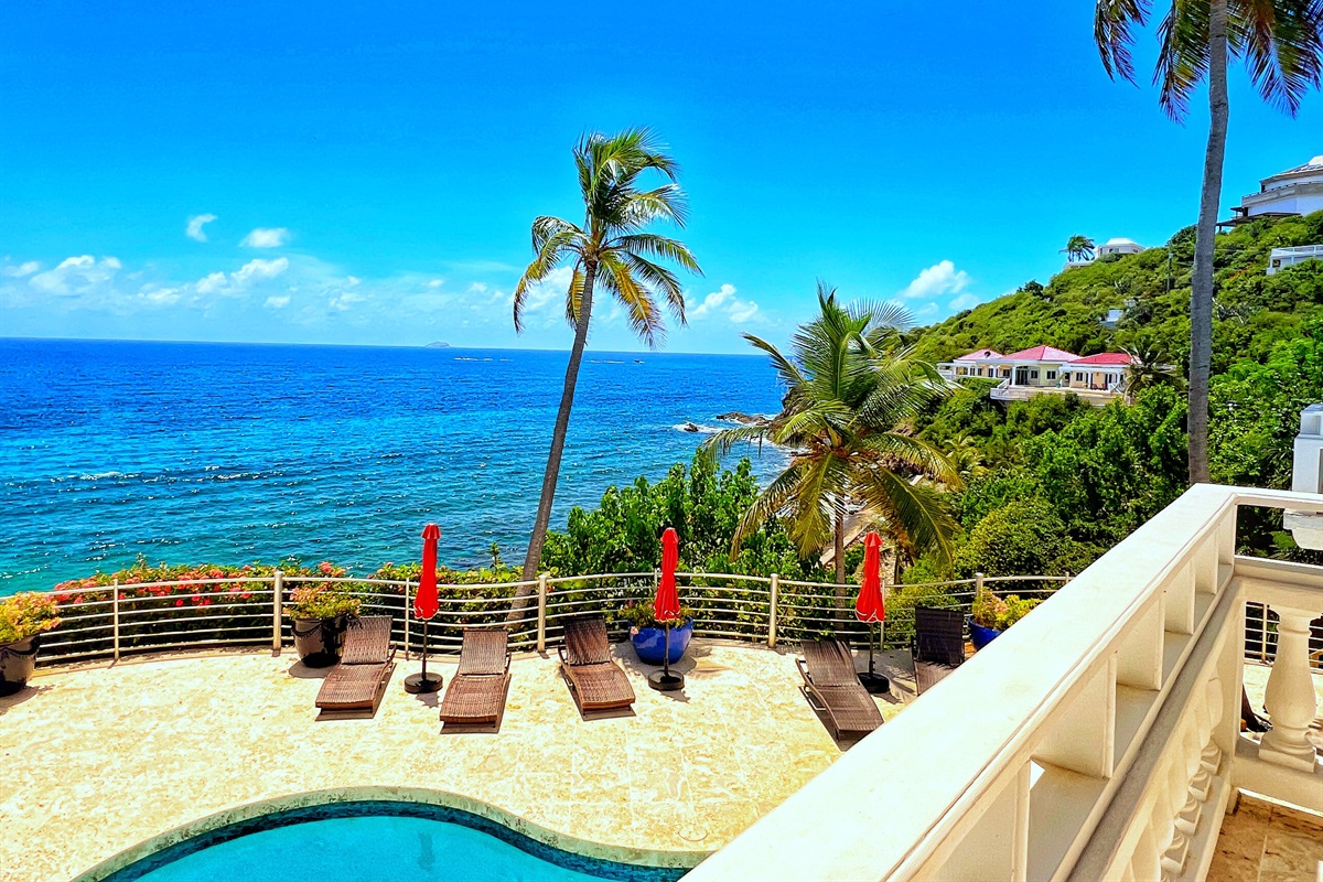 Relax poolside under swaying palms and Caribbean skies.