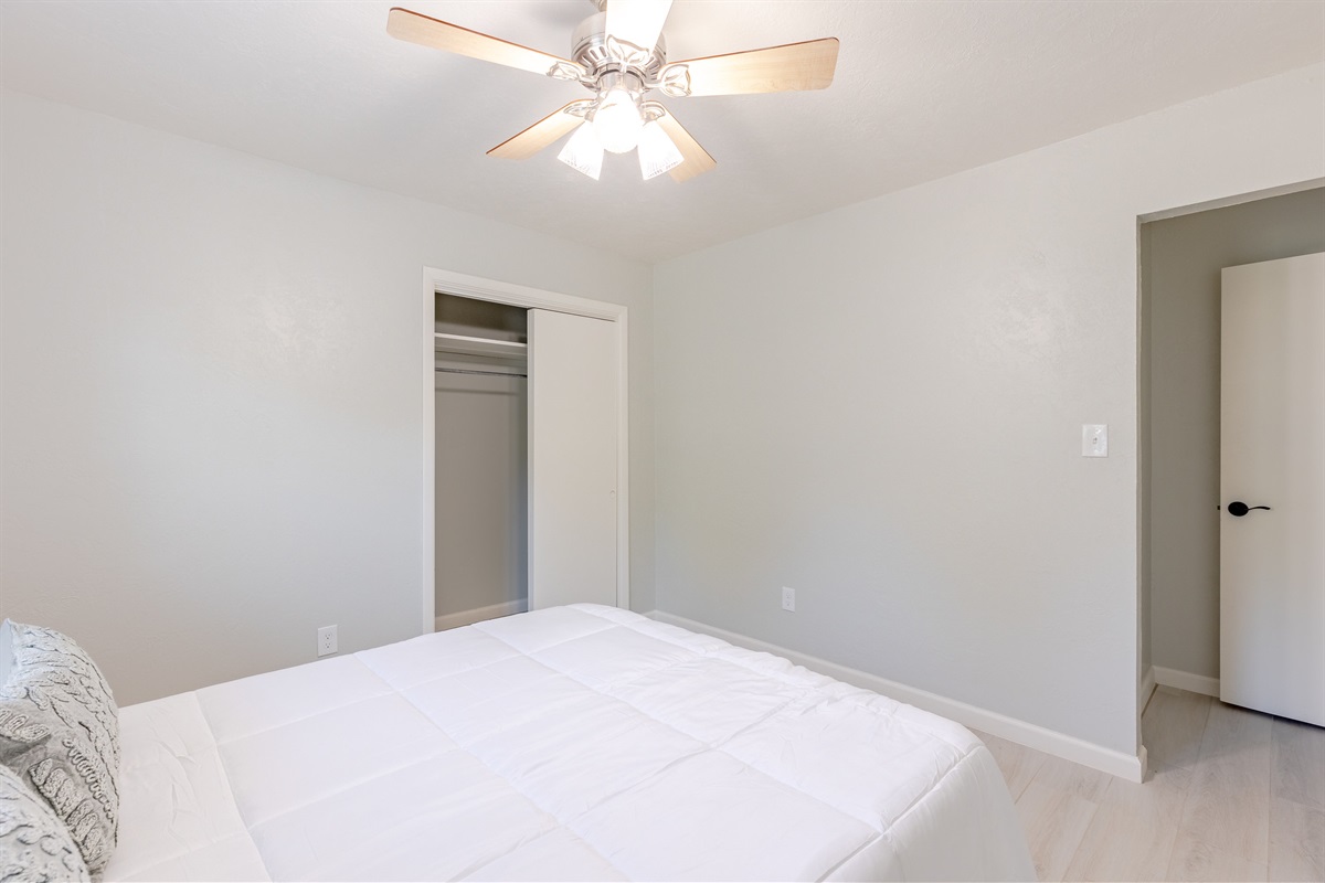 Bright and comfortable guest room with a cozy queen bed.