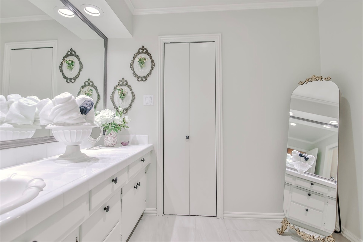 A well-appointed shared bath that balances privacy with elegant comfort, ideal for guests.