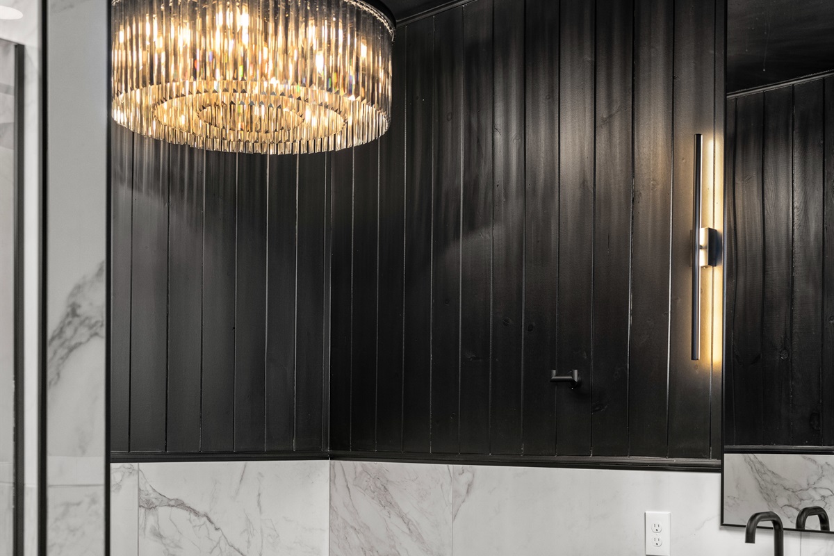 Bathroom Retreat: Indulge in luxury with a sleek soaking tub and elegant lighting.