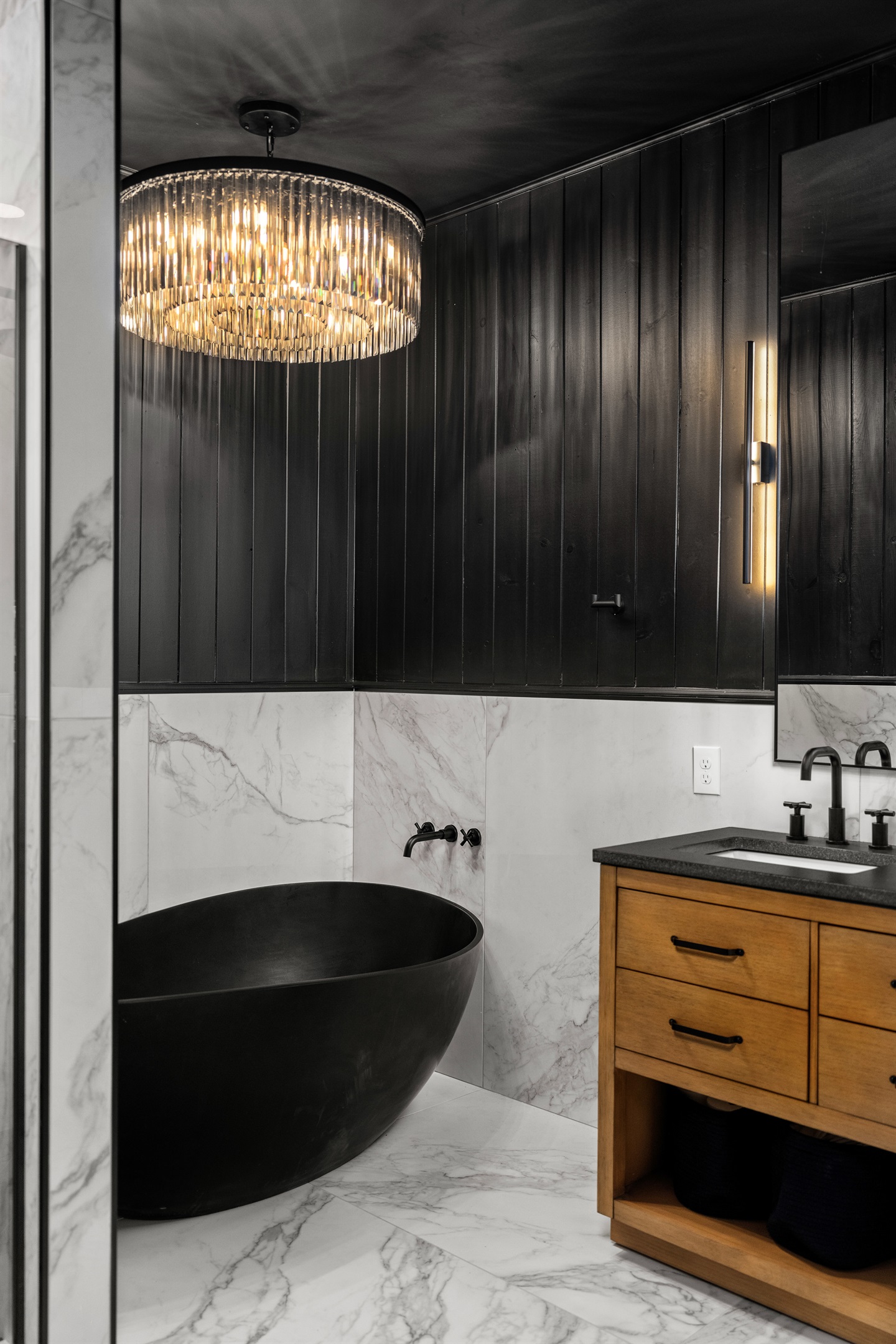 Bathroom Retreat: Indulge in luxury with a sleek soaking tub and elegant lighting.
