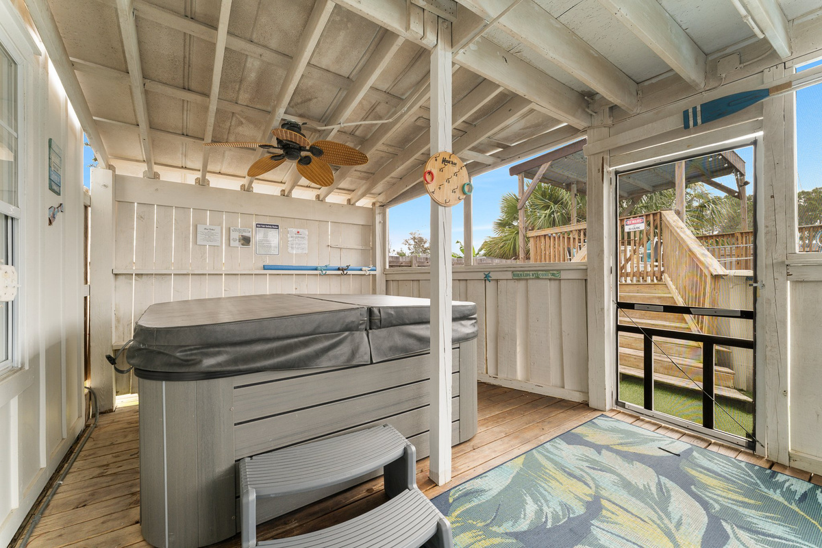 Covered hot tub, dartboard, sunroom interior