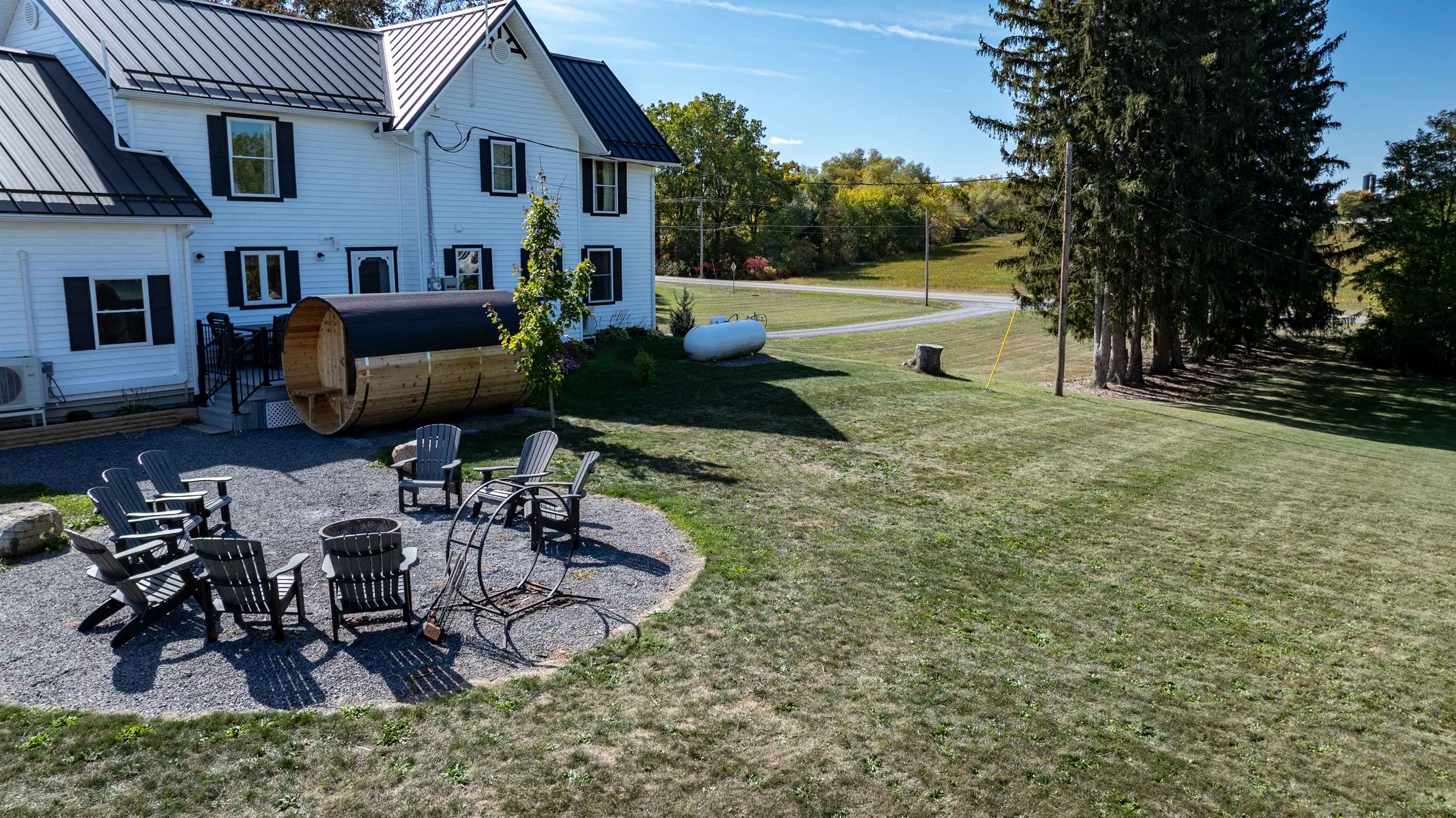 Spacious backyard with a sauna and patio — ideal for morning coffee, family fun, or evening relaxation