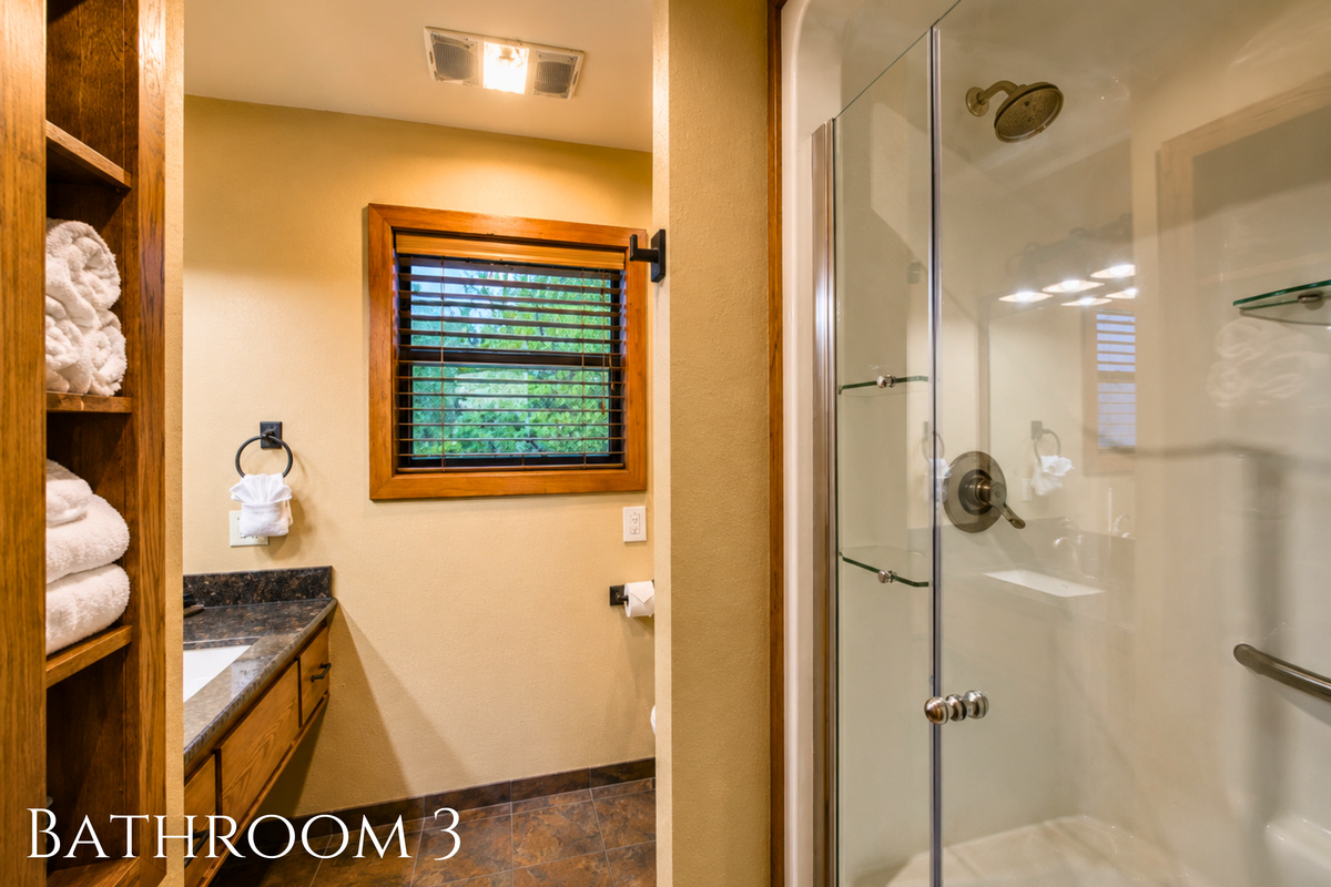 Bright and functional, this full bath includes a glass shower, generous counter space, and everything you need for an easy start or end to the day.