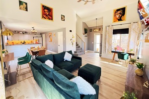 Spacious, modern, and inviting living room. A perfect space to share stories and laughters with friends and family.