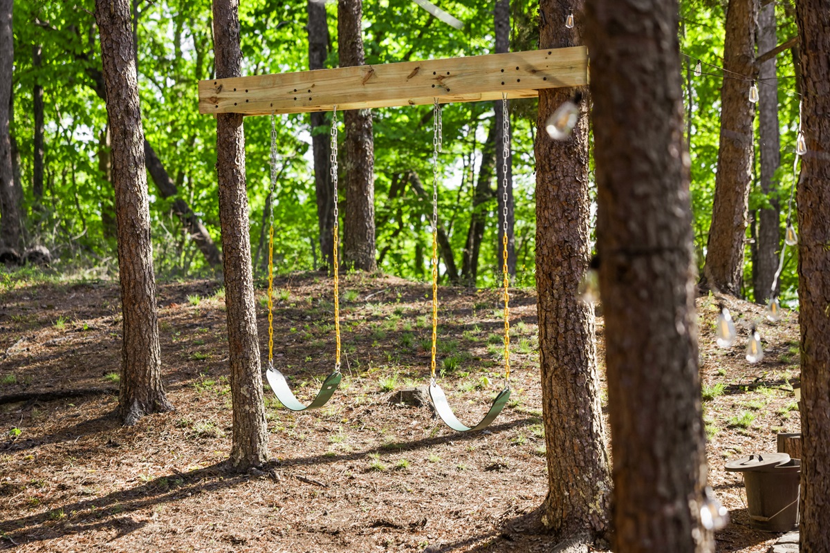 Children's swings near the firepit, so adults can relax around a cozy fire while the kids play