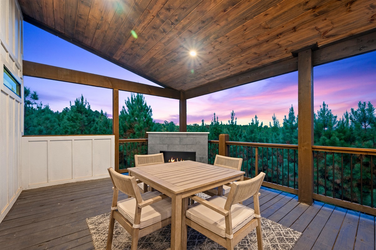 Outdoor dining space overlooking the trees—perfect for meals with a view.