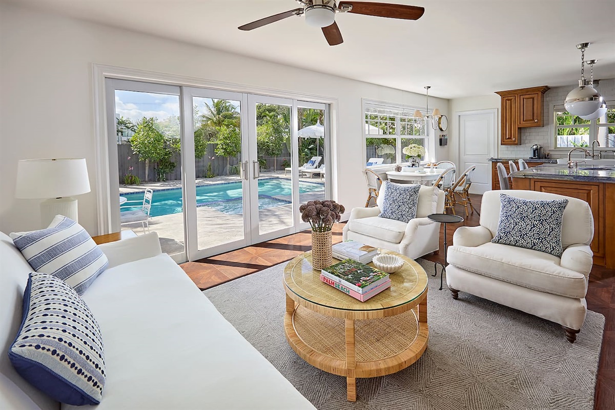 Relax in the inviting living room and take in the lovely views of the sparkling salt water pool and lush, tropical landscaping.
