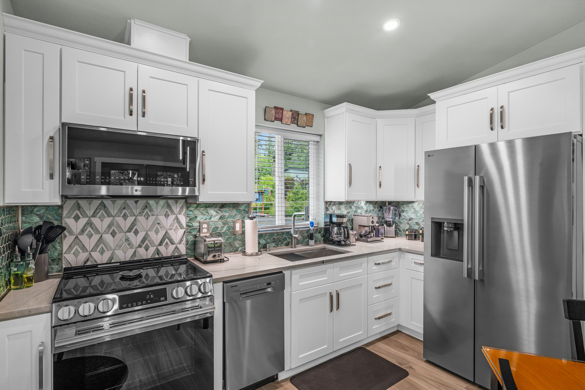 5-Burner oven with built-in air fryer; dishwasher; side-by-side fridge with filtered water and ice