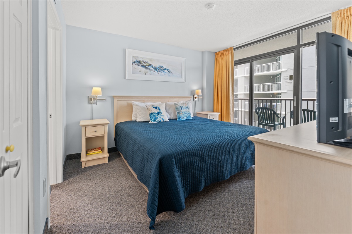 Main Bedroom with king bed, on suite and access to balcony