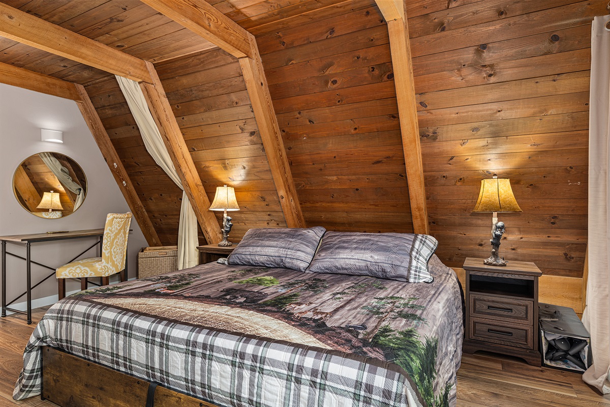 Snuggle up in this warm and woodsy master retreat.