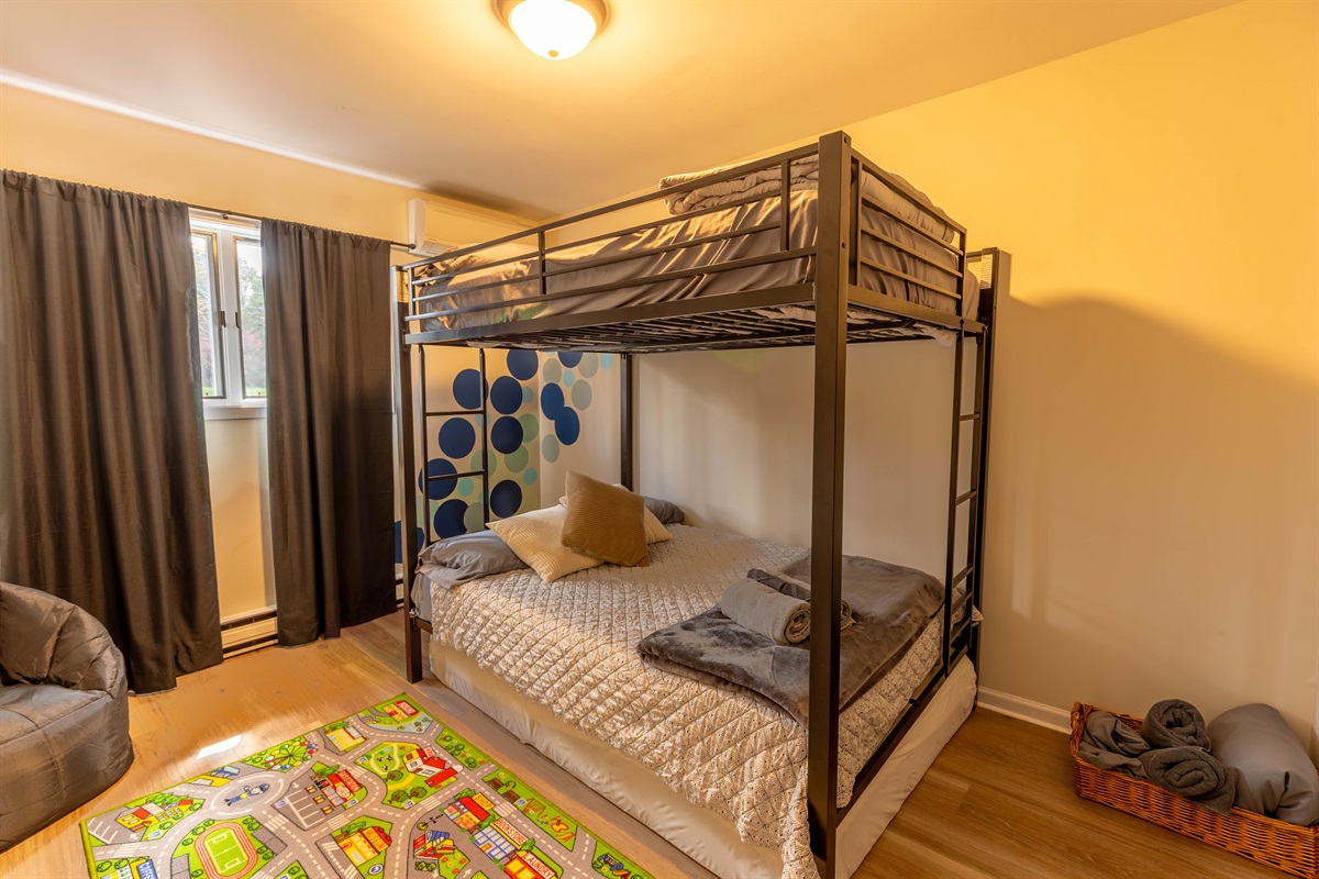 The bunk beds feature double-sized mattresses, making this room ideal for sleepovers and late-night storytelling. It's the perfect bedroom for kids or those young at heart