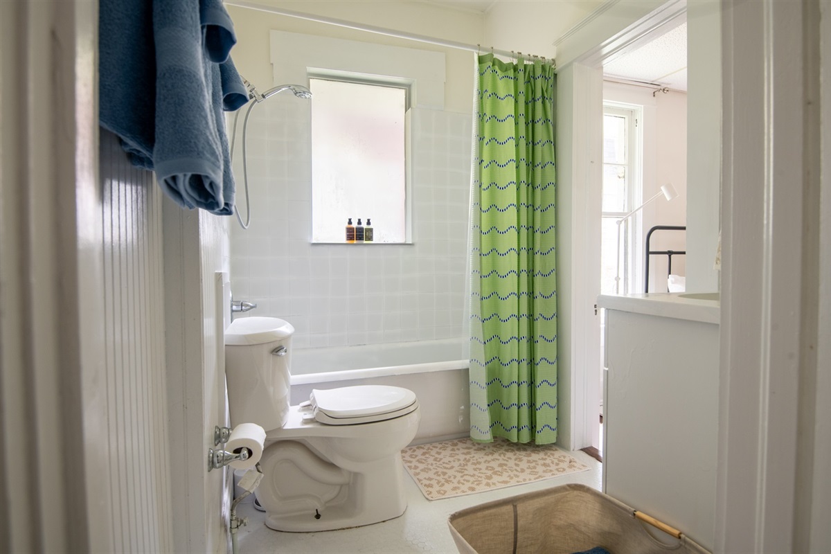 Fresh and bright bathroom with clean towels and a refreshing shower.