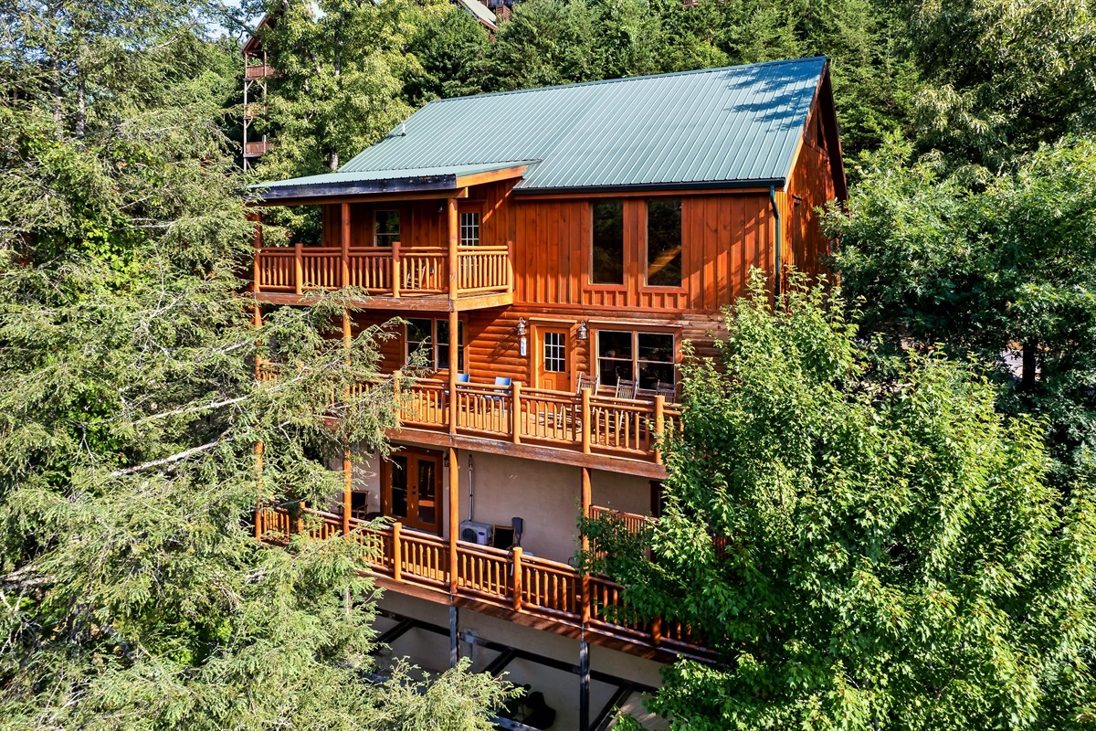 Step back and admire this stunning three story cabin wrapped in trees and views, designed for unforgettable group escapes.