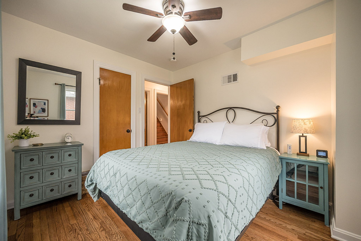 Each bedroom closet contains a blanket, fan, hangers, luggage rack, and a hamper.