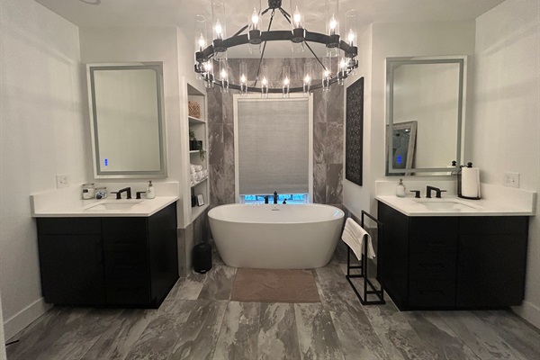 Unwind in this elegant freestanding soaking tub perfect for a peaceful spa-like escape