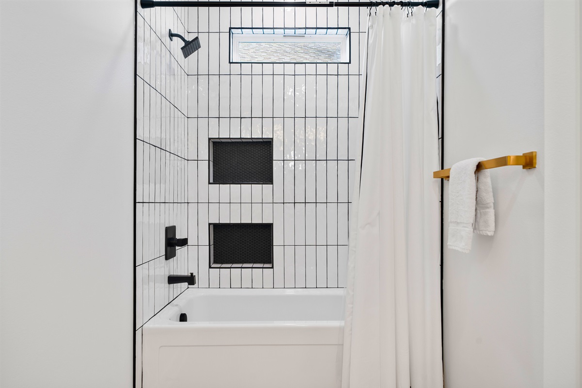 The shower area is clean, simple, and designed for everyday comfort.