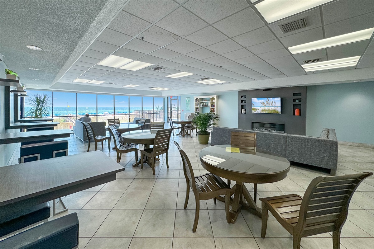 Our spacious lobby offers a welcoming atmosphere, featuring plentiful seating areas ideal for gathering, reading, or simply enjoying the serene ocean vista. It's the perfect place to unwind up