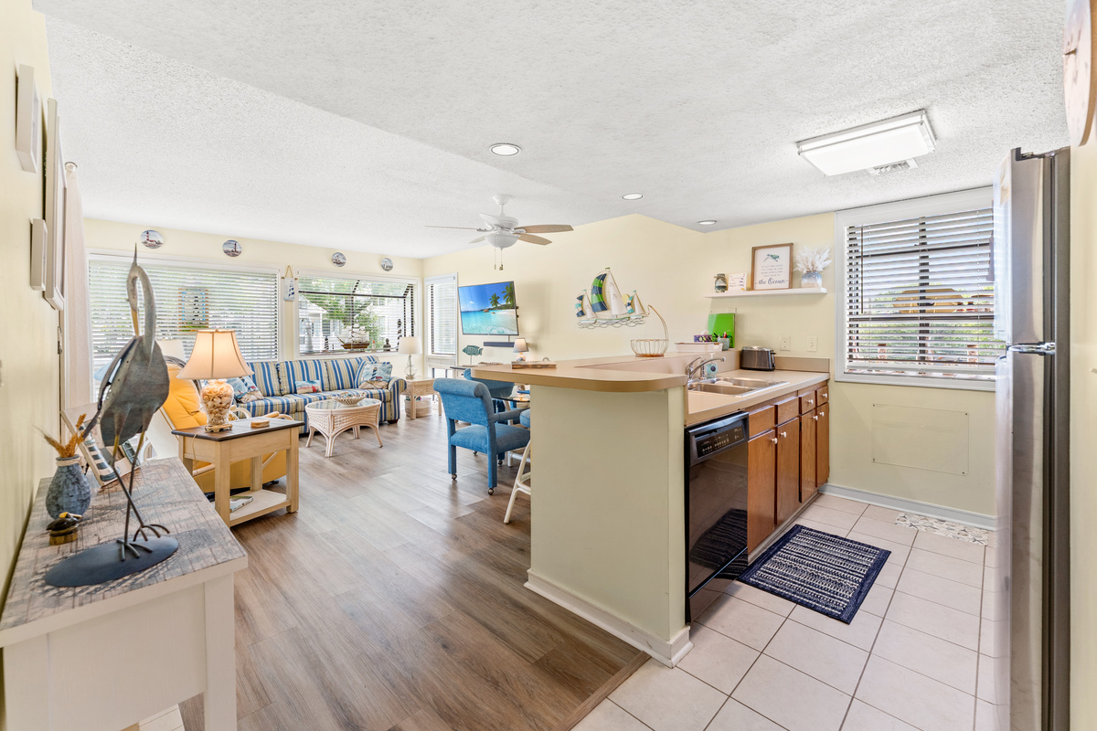 Open concept, kitchen, dining and living room area