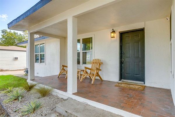 Covered front porch with seating—perfect for coffee or evening chats