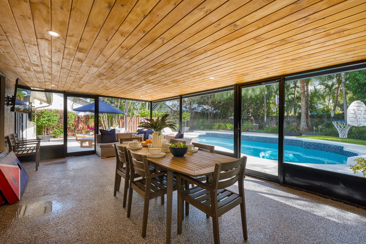 Enjoy the glow of ambient lighting in this spacious screened patio&mdash;perfect for quiet mornings or relaxed evening meals.