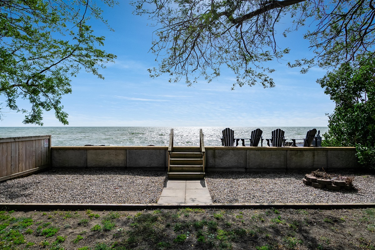 Water's edge deck with muskoka chairs