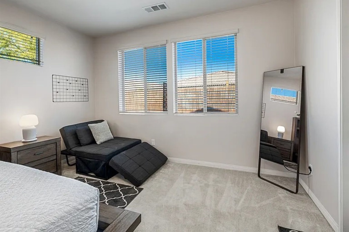 Master bedroom with direct access to patio and chair to fold into twin bed