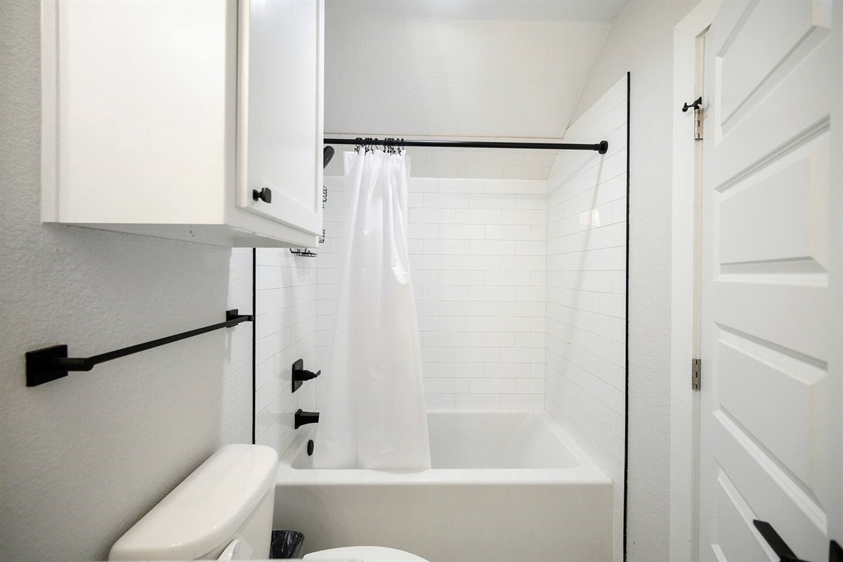 Loft bathroom with tub shower