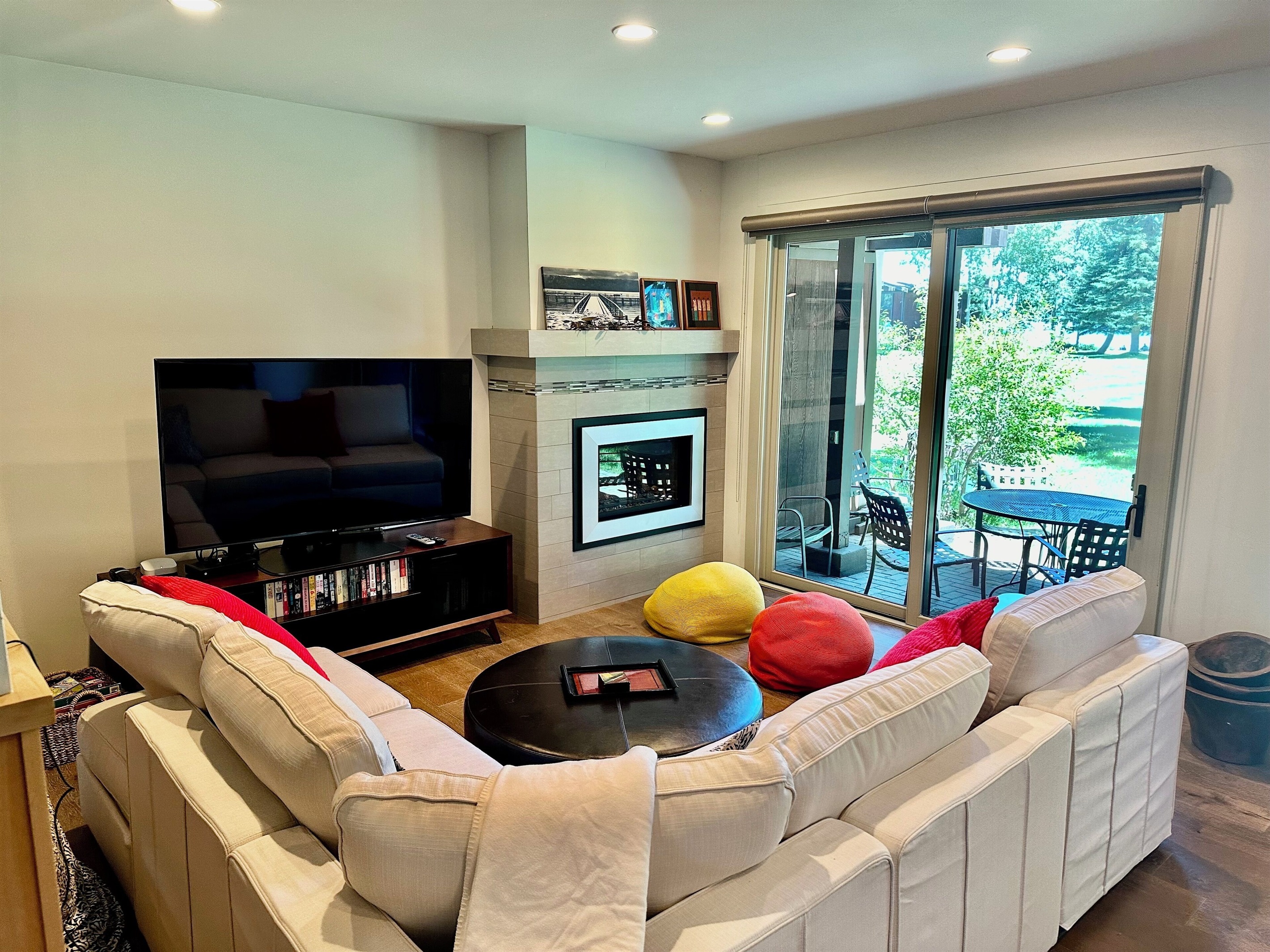 Private patio off the living room has barbecue and dining table/chairs