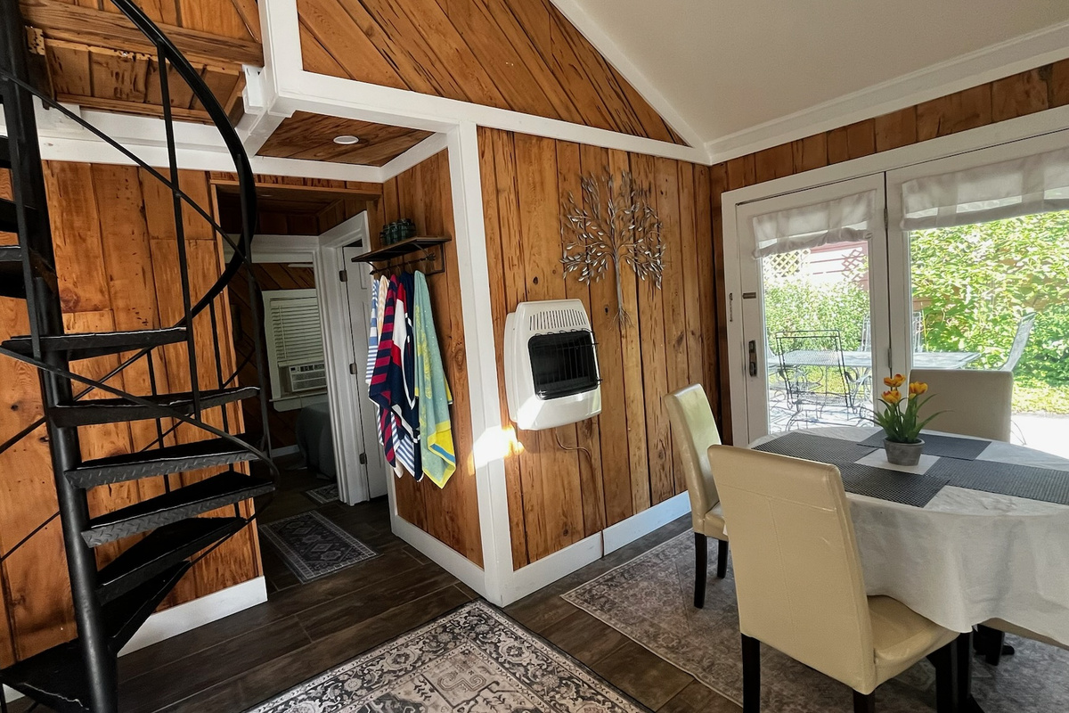 Dining Room with door leading outside to covered gazebo with more seating and a native plant garden. 