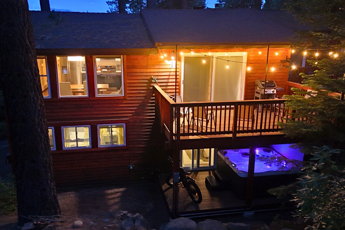 A private and secluded lower deck featuring a brand-new hot tub for ultimate relaxation.  