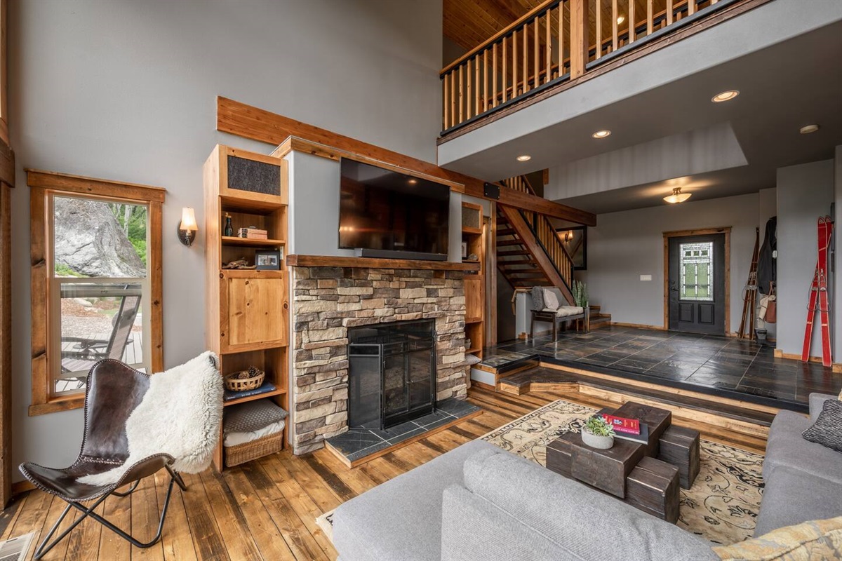 Living room with gas fireplace and smart TV