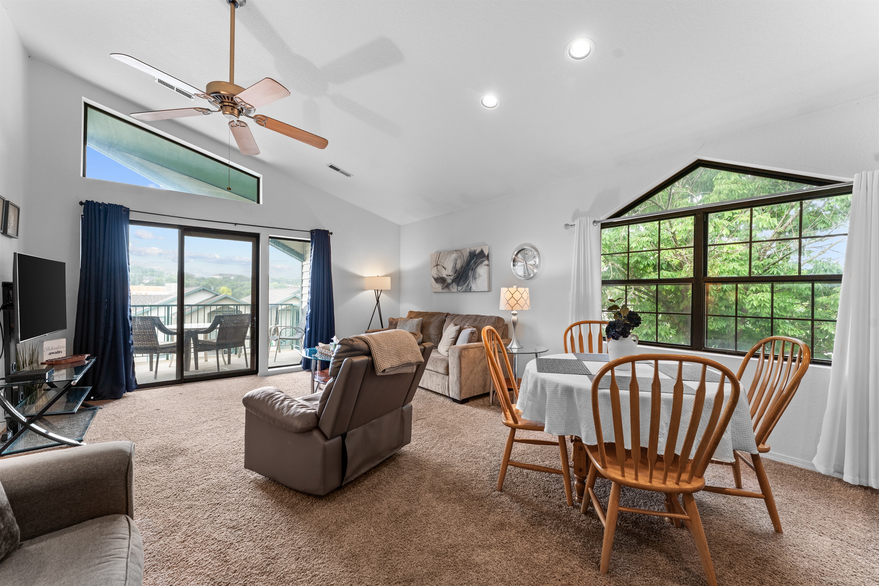 Cathedral ceilings, big windows, and an open layout make the main living space feel airy and easy to settle into.