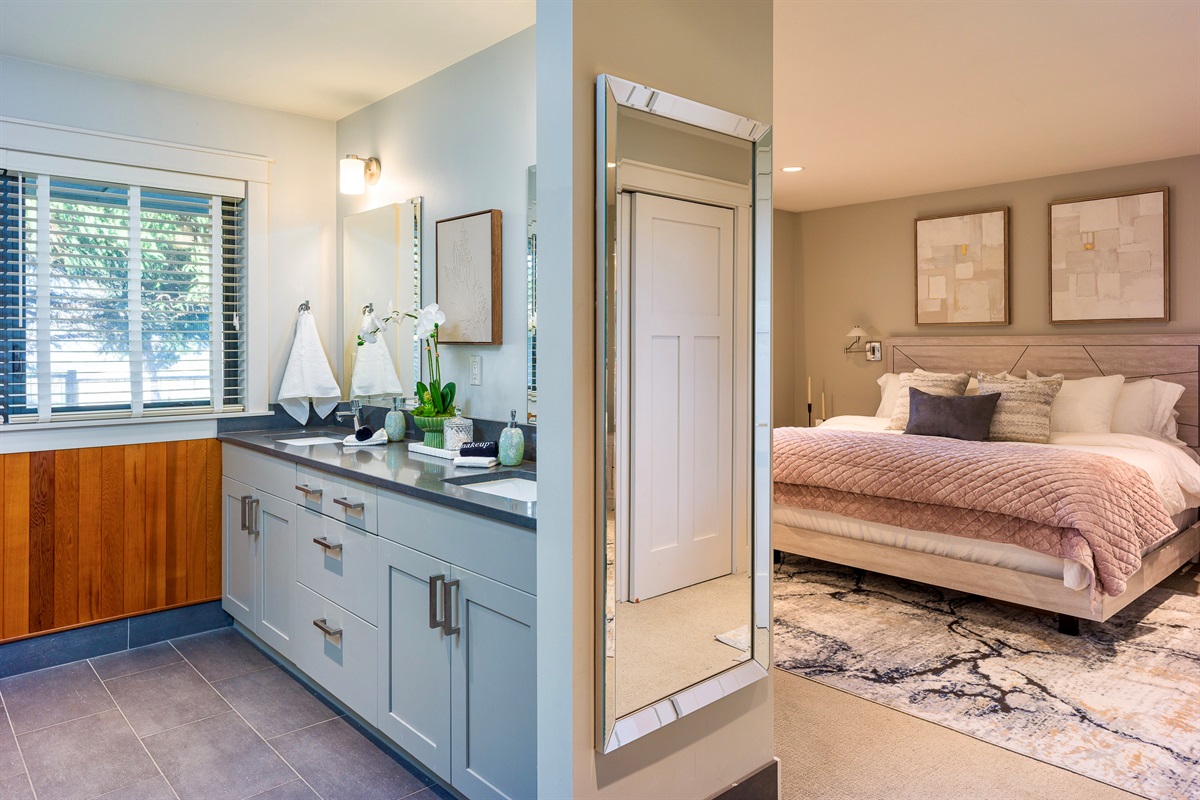 Expansive primary suite with a spa-like open bathroom layout and discreetly enclosed toilet.