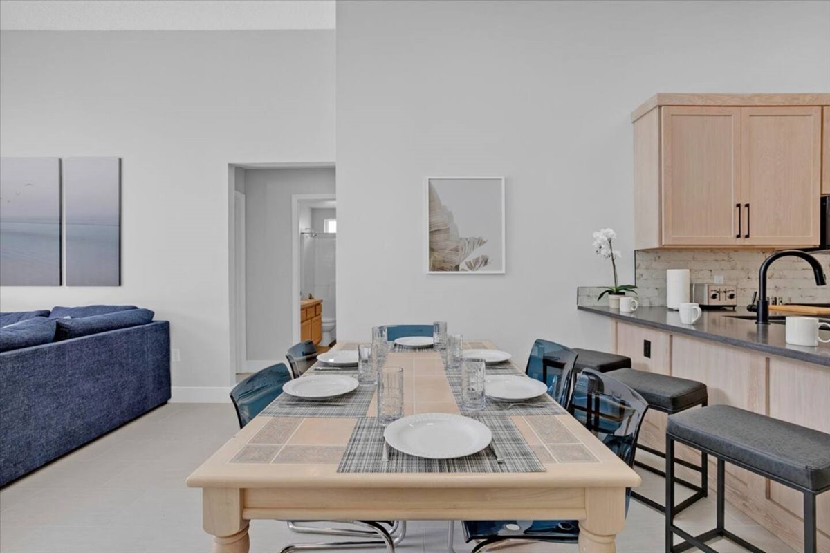 We have two dining tables inside. This one has seating spaces to comfortable accommodate 6 guests, or you can squeeze up to 8!