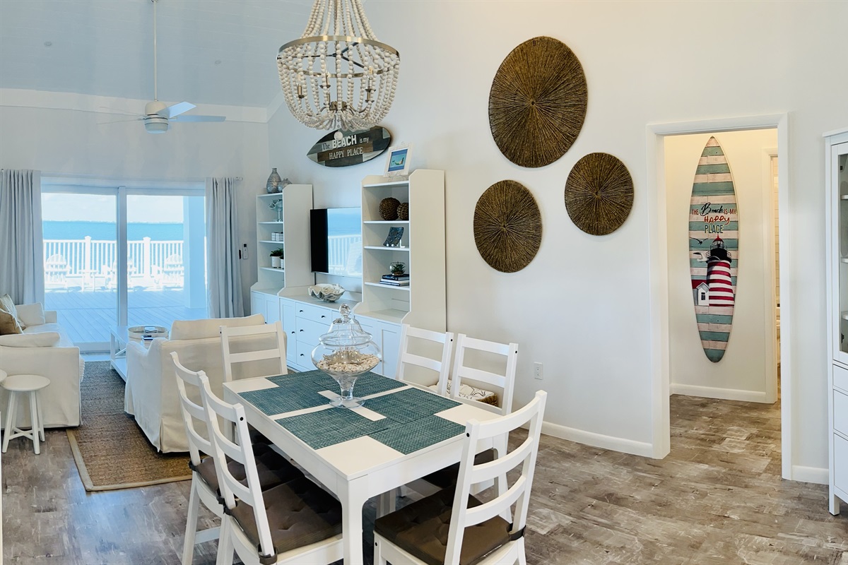 STARFISH BAY Living room sliding doors exit to the covered patio and open deck.