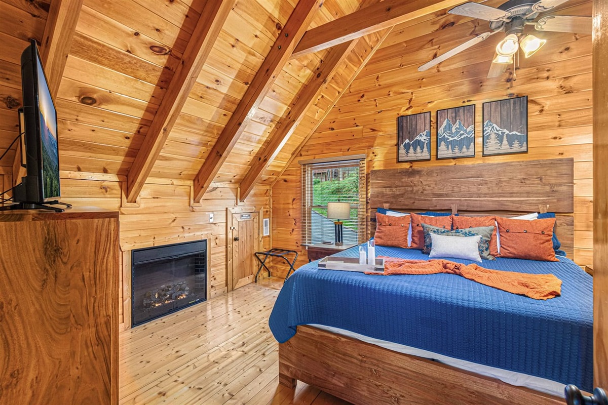 Electric fireplace and King bed in master loft