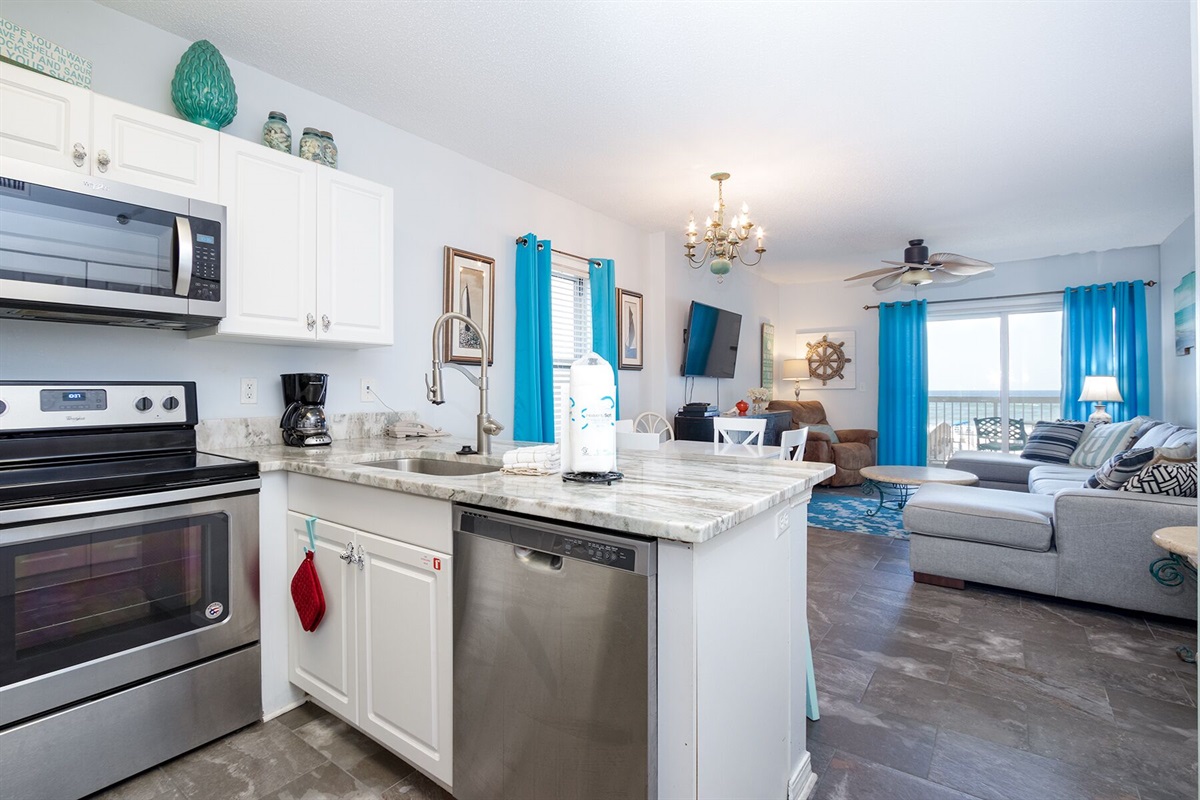 Kitchen with wood cabinets, granite countertops and stainless steel appliances