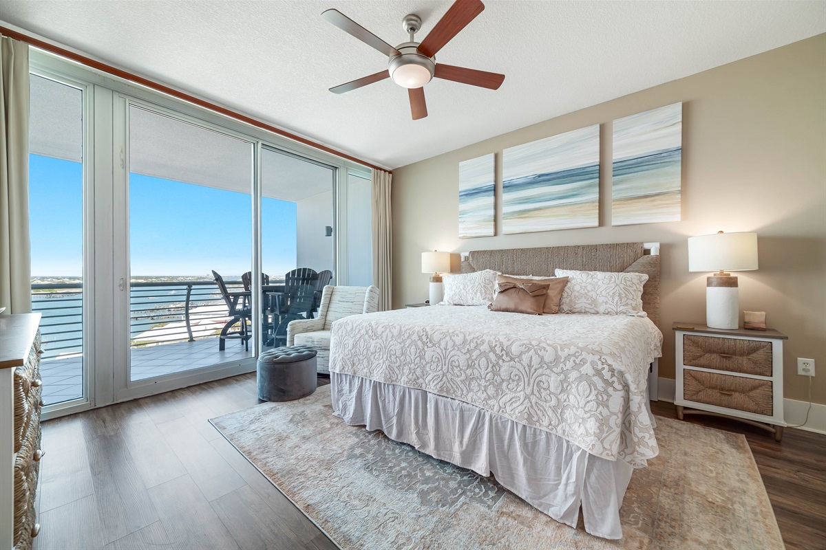 Enjoy a restful night's sleep with panoramic coastal views from this beautifully designed Primary bedroom with king-size bed. The seamless transition to the balcony allows you to fully immerse yourself in the beauty of Ole River.