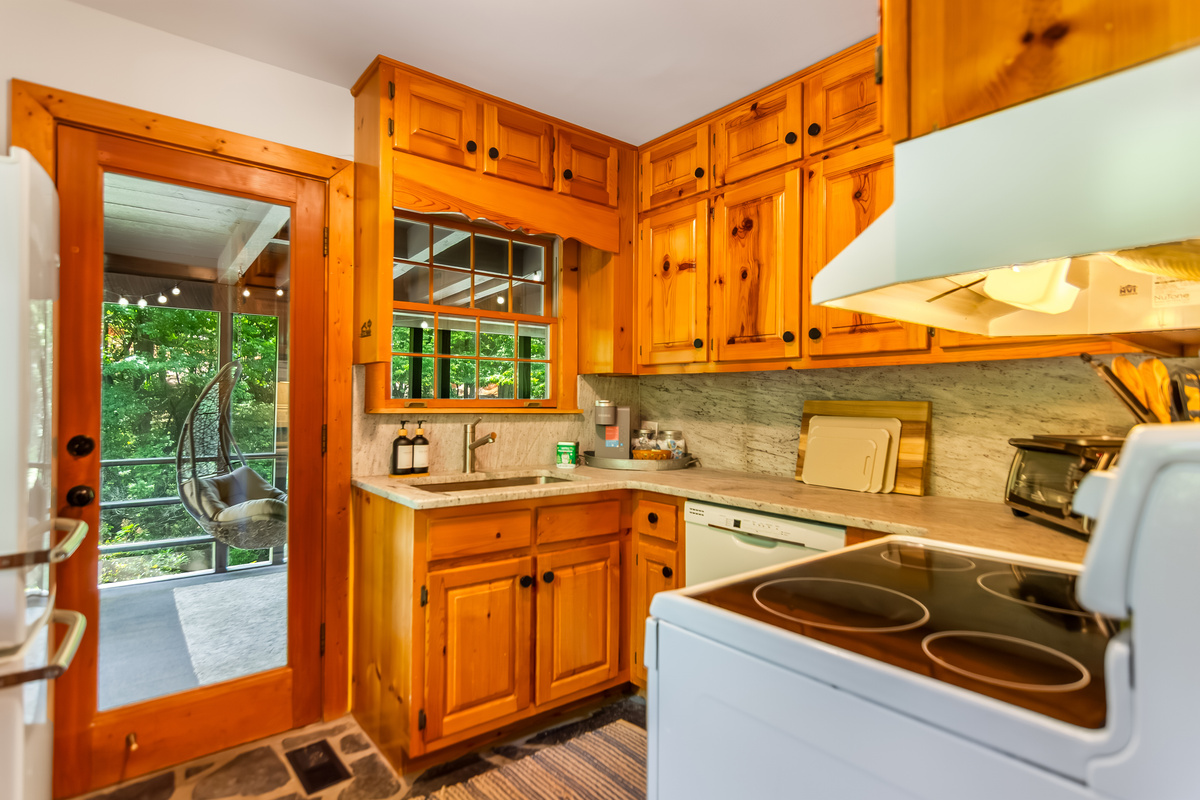 Kitchen and door leading to the screened porch 