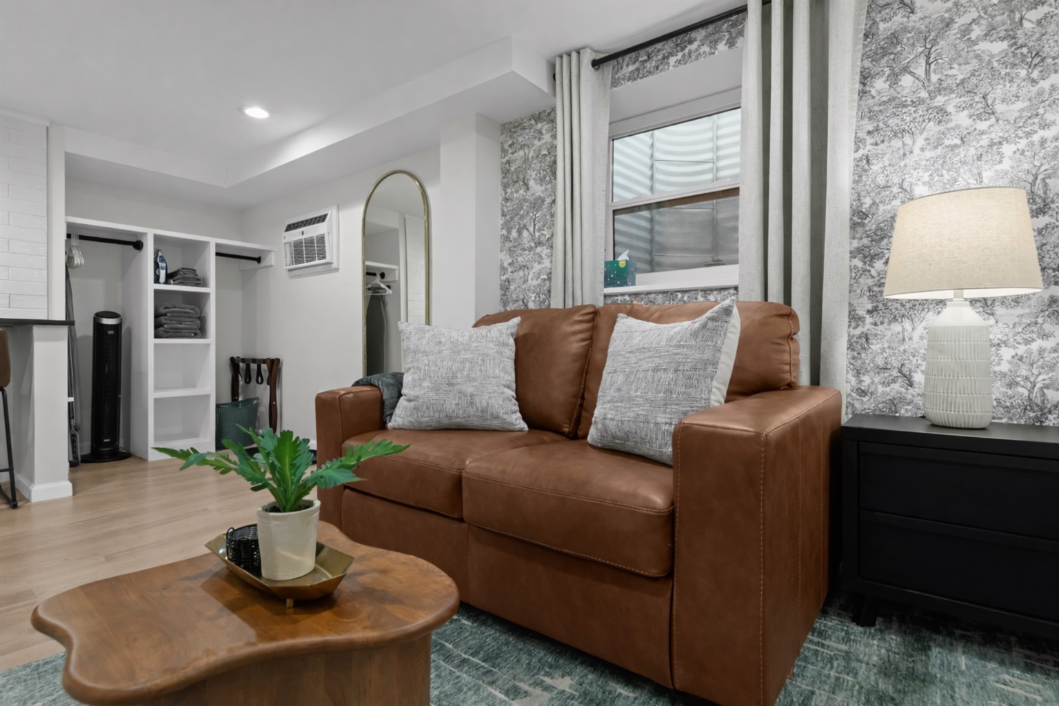 Cozy seating area with a plush sofa, soft lighting, and stylish accents—perfect for relaxing after a day out or unwinding indoors.