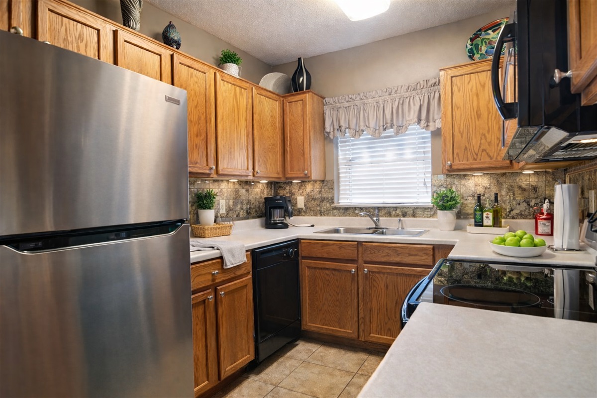 Fully equipped kitchen with full-size appliances — ideal for family meals during your Smoky Mountain getaway.