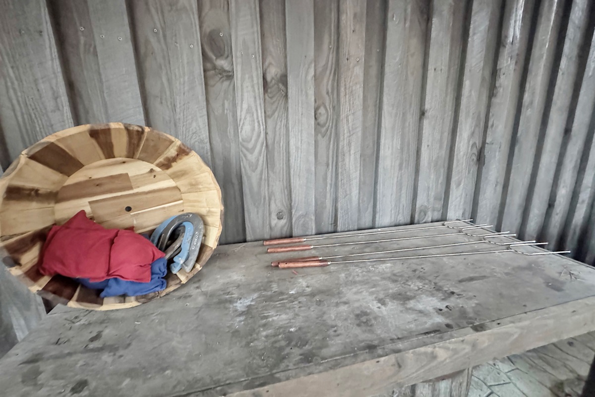 Cornhole bags, horsehoes, and marshmallow roasting sticks.