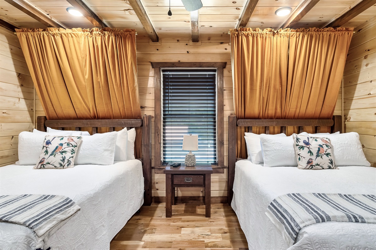 The Gold bedroom (downstairs) has 2 queen beds and a private bathroom