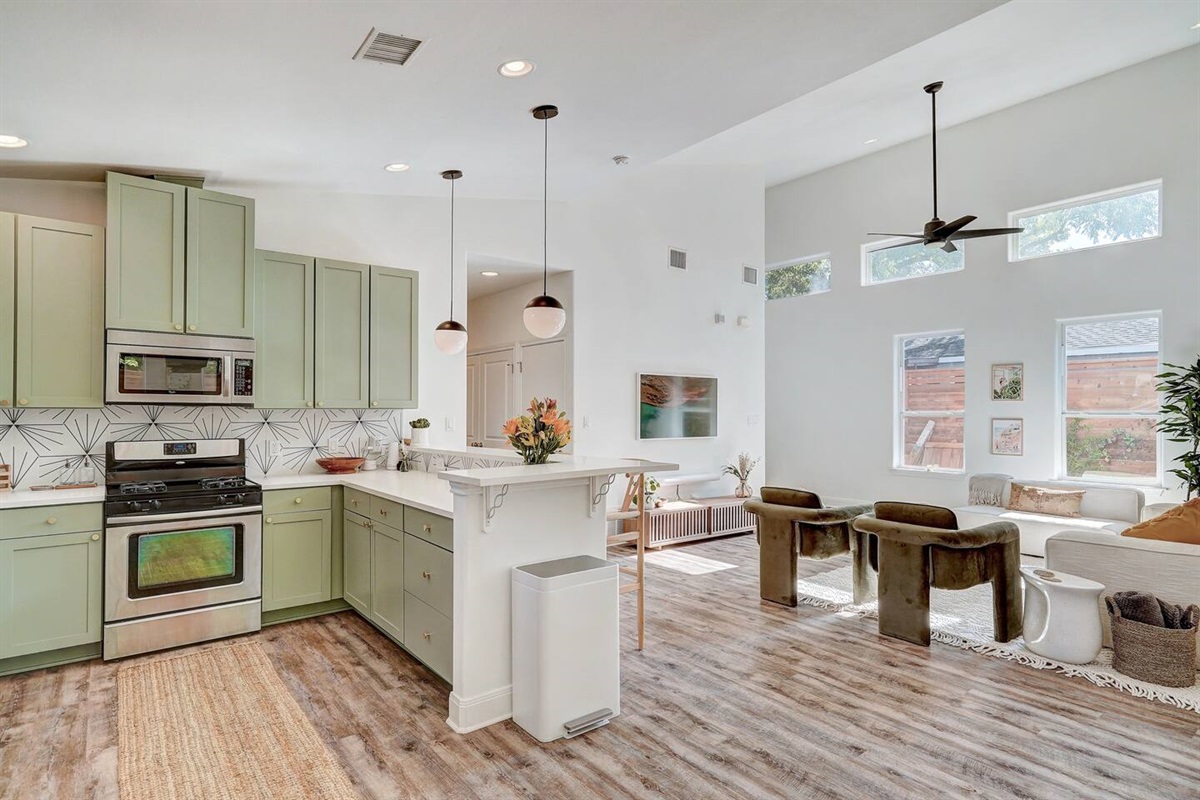 Open concept living, dining and kitchen area.